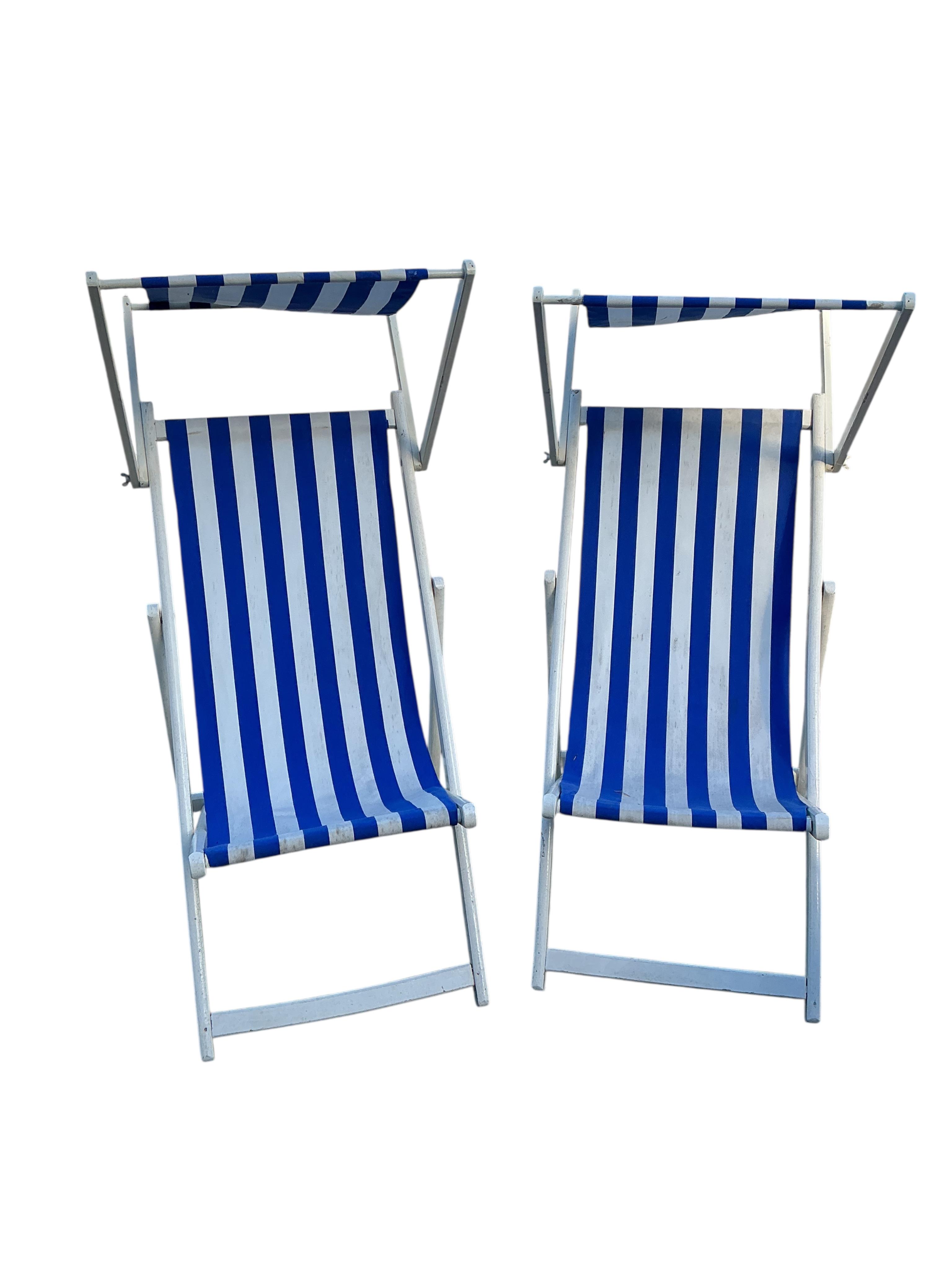 A set of four early 20th century deck chairs, two with footrests and two with sun shades